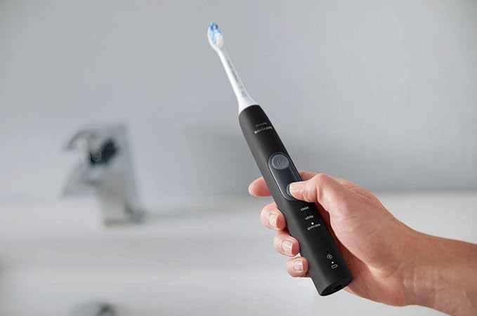 Philips Sonicare ProtectiveClean 5300 Rechargeable Electric Toothbrush with Pressure Sensor 3 Cleaning Modes SmarTimer and QuadPacer with 2 Bonus Brush Heads Travel Case Black Model HX6423/34
